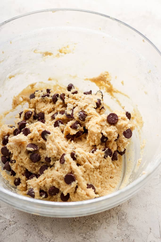 Chocolate chip cookie dough in a bowl.