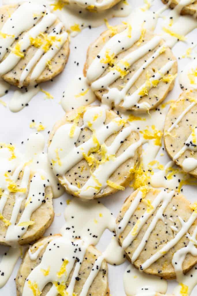 A group of cookies with white frosting.