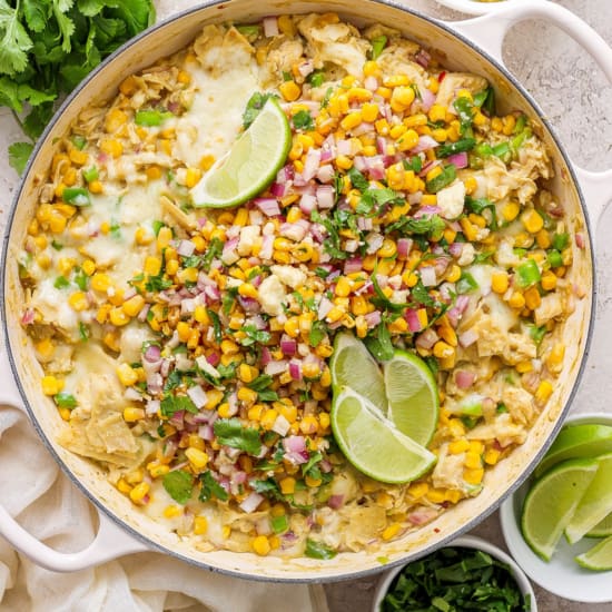 Mexican corn enchiladas in a skillet.