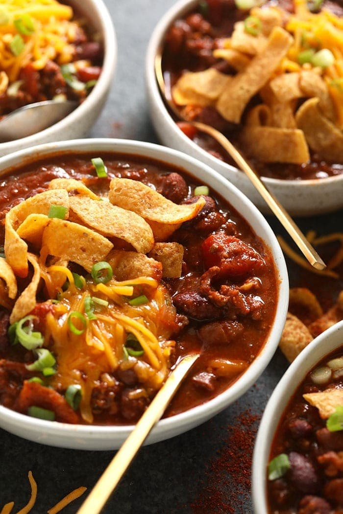 bowl of beef chili with Fritos and shredded cheese.